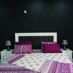 Royal purple and white paisley floral duvet cover set with four matching pillowcases on a modern bed