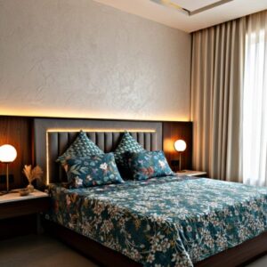 Teal blue and white floral quilted bedspread set with four matching pillowcases on a wooden bed with warm backlighting