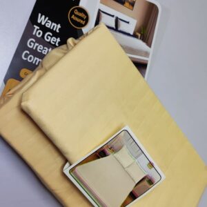 Luxury fitted bed sheet set folded with two matching pillowcases