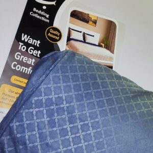 Slate blue geometric lattice print bed sheet set folded in packaging