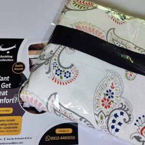 White bed sheet set with grey, red, and blue traditional paisley print folded in packaging