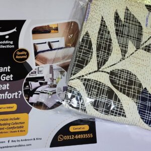 Cream bed sheet set with black grid-patterned leaves and blue accents folded in packaging